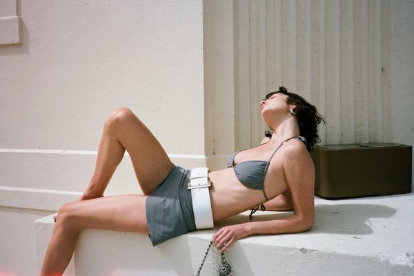 Girl in MISE swimwear, lying down